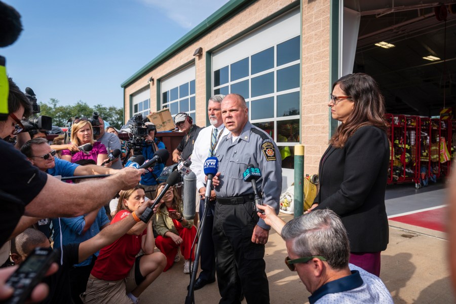 Lt. Col. George Vivens, front, speaks during a media tour, at the Po-Mar-Lin Fire Company, which is serving as the Incident Command Center for the ongoing intergovernmental manhunt escaped prisoner Danelo Cavalcante, of Unionville, Pa., Friday, Sept. 8, 2023. (Jessica Griffin/The Philadelphia Inquirer via AP)